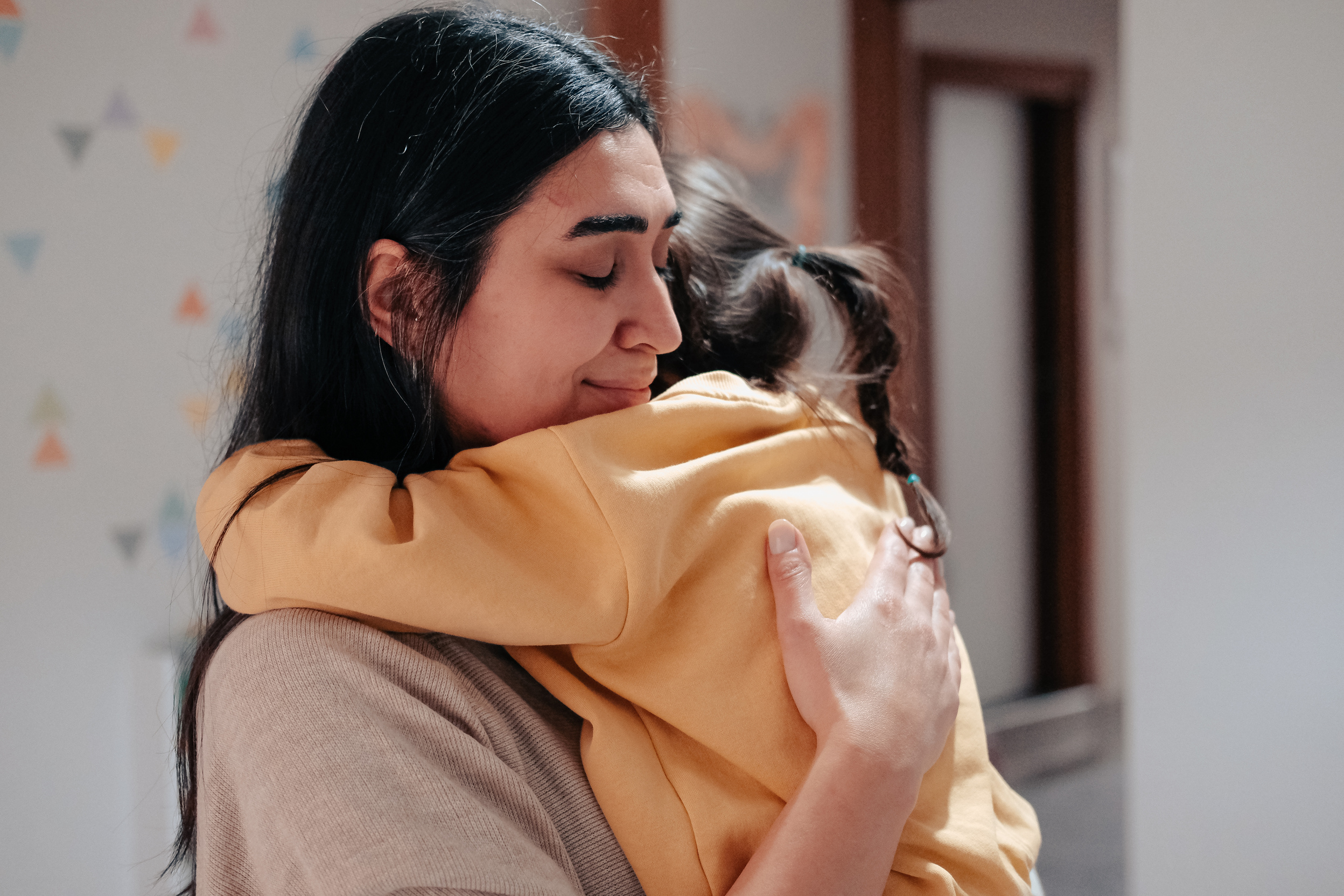 Girl Hugging Mother